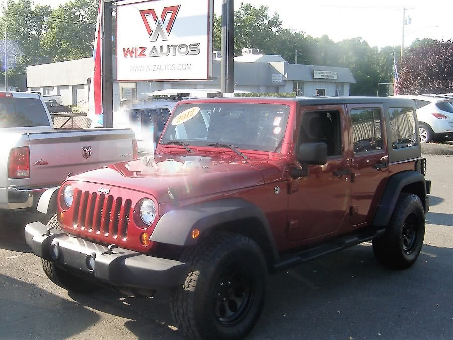 2012 Jeep Wrangler Unlimited 4WD 4dr Sport, available for sale in Stratford, Connecticut | Wiz Leasing Inc. Stratford, Connecticut