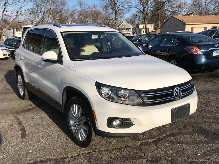 2012 Volkswagen Tiguan 4WD 4dr Auto SE w/Sunroof & Nav, available for sale in Manchester, Connecticut | Jay's Auto. Manchester, Connecticut