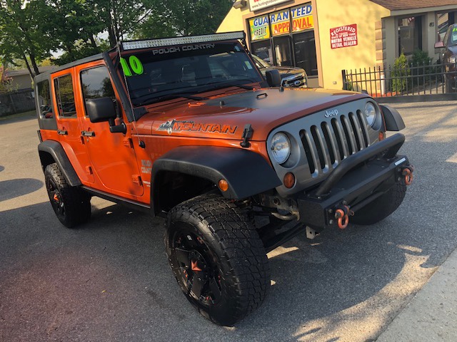 2010 Jeep Wrangler Unlimited 4WD 4dr MOUNTAIN, available for sale in Huntington Station, New York | Huntington Auto Mall. Huntington Station, New York