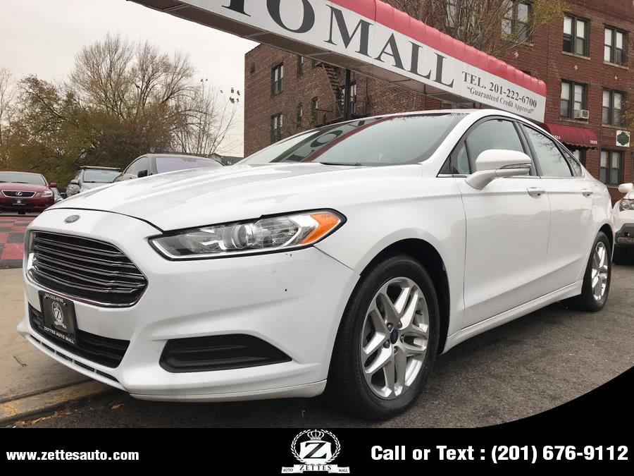 2014 Ford Fusion 4dr Sdn SE FWD, available for sale in Jersey City, New Jersey | Zettes Auto Mall. Jersey City, New Jersey