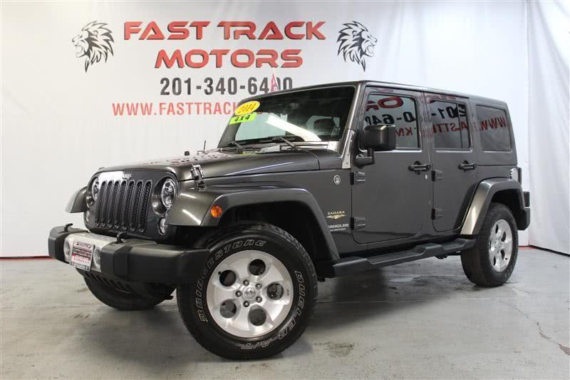 2014 Jeep Wrangler Unlimited SAHARA, available for sale in Paterson, New Jersey | Fast Track Motors. Paterson, New Jersey
