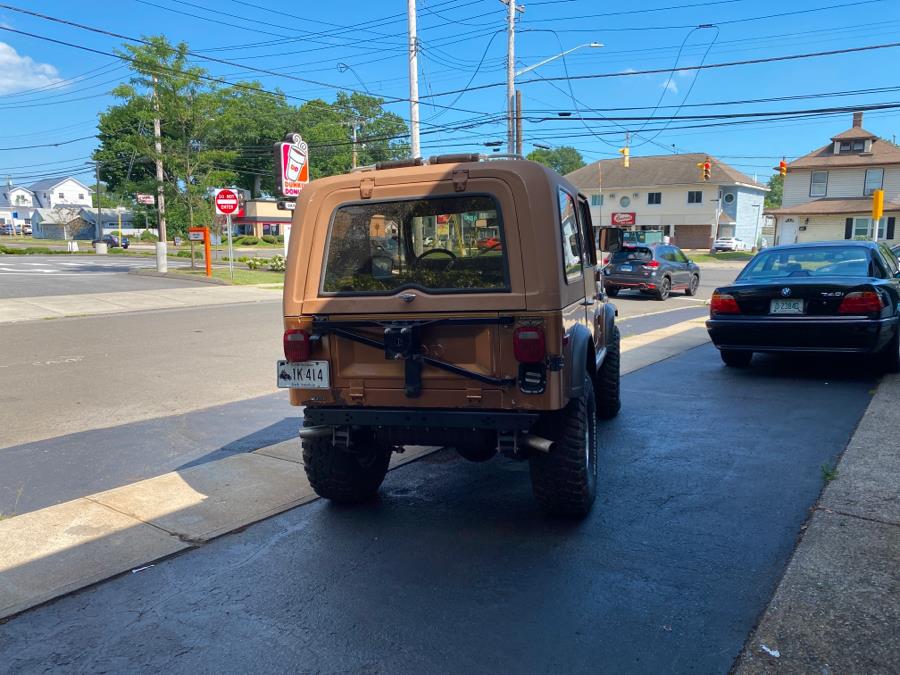 1979 Jeep CJ7 Wrangler Golden Eagle, available for sale in Milford, Connecticut | Village Auto Sales. Milford, Connecticut 1979 Jeep CJ7 Wrangler Golden Eagle, available for sale in Milford, Connecticut | Village Auto Sales. Milford, Connecticut