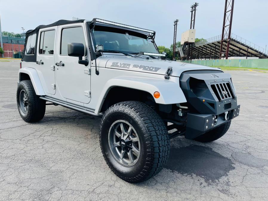 2012 Jeep Wrangler Unlimited 4WD 4dr Altitude, available for sale in New Britain, Connecticut | Supreme Automotive. New Britain, Connecticut