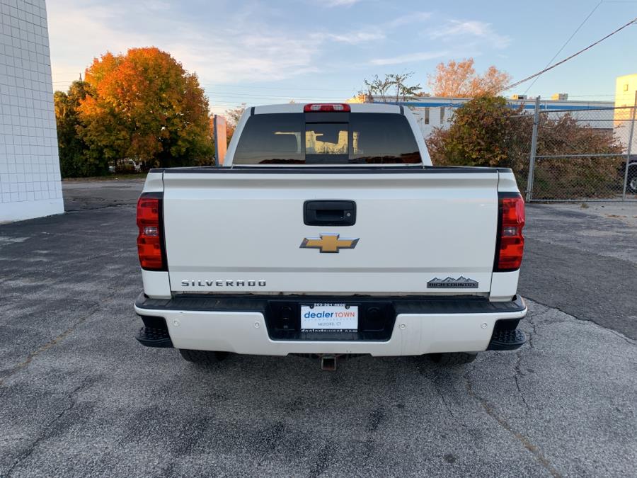 Used Chevrolet Silverado 1500 4WD Crew Cab 143.5" High Country 2014 | Dealertown Auto Wholesalers. Milford, Connecticut Used Chevrolet Silverado 1500 4WD Crew Cab 143.5" High Country 2014 | Dealertown Auto Wholesalers. Milford, Connecticut