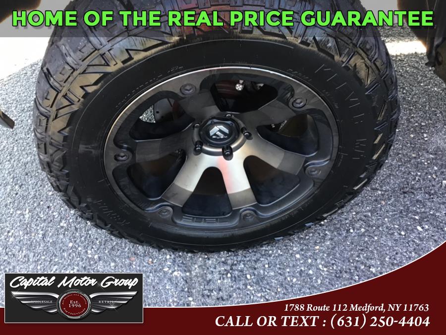 Used Ram 1500 4WD Crew Cab 140.5" Laramie 2014 | Capital Motor Group Inc. Medford, New York Used Ram 1500 4WD Crew Cab 140.5" Laramie 2014 | Capital Motor Group Inc. Medford, New York