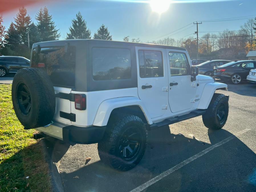 2012 Jeep Wrangler Unlimited 4WD 4dr SAHARA, available for sale in Berlin, Connecticut | Tru Auto Mall. Berlin, Connecticut 2012 Jeep Wrangler Unlimited 4WD 4dr SAHARA, available for sale in Berlin, Connecticut | Tru Auto Mall. Berlin, Connecticut