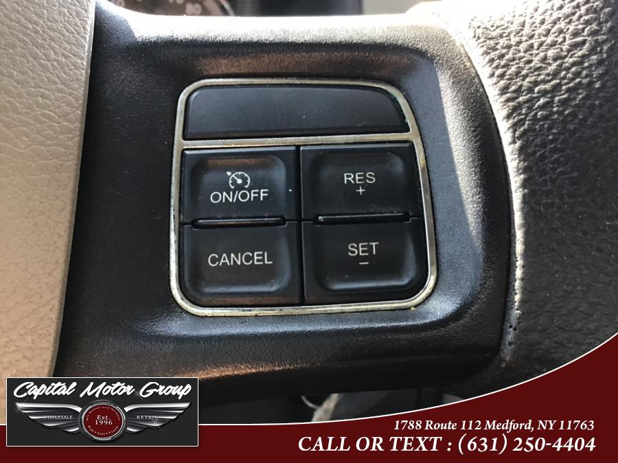 Used Ram 1500 4WD Quad Cab 140.5" SLT 2012 | Capital Motor Group Inc. Medford, New York Used Ram 1500 4WD Quad Cab 140.5" SLT 2012 | Capital Motor Group Inc. Medford, New York