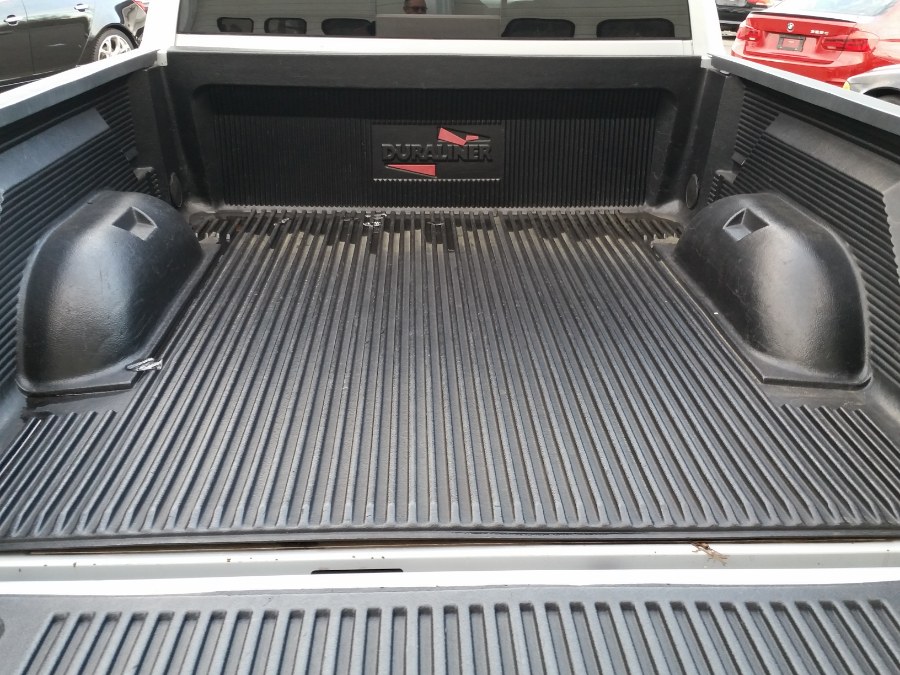 2012 Ram 1500 4WD Quad Cab 140.5" SLT, available for sale in Berlin, Connecticut | Action Automotive. Berlin, Connecticut 2012 Ram 1500 4WD Quad Cab 140.5" SLT, available for sale in Berlin, Connecticut | Action Automotive. Berlin, Connecticut