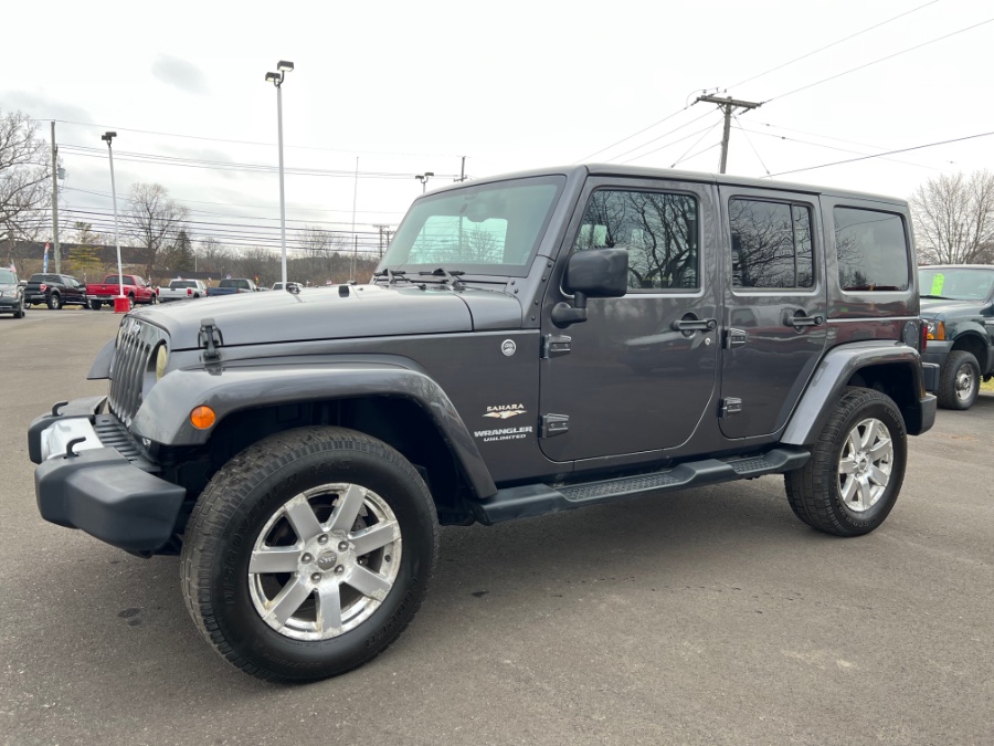 2014 Jeep Wrangler Unlimited 4WD 4dr Sahara, available for sale in Ortonville, Michigan | Marsh Auto Sales LLC. Ortonville, Michigan