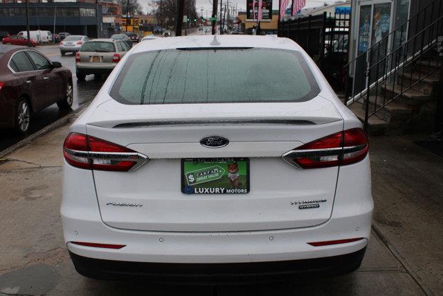2020 Ford Fusion Hybrid Titanium, available for sale in Elmont, New York | NY Luxury Motors. Elmont, New York 2020 Ford Fusion Hybrid Titanium, available for sale in Elmont, New York | NY Luxury Motors. Elmont, New York