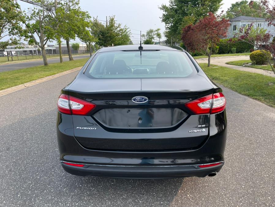 2014 Ford Fusion 4dr Sdn SE Hybrid FWD, available for sale in Copiague, New York | Great Deal Motors. Copiague, New York