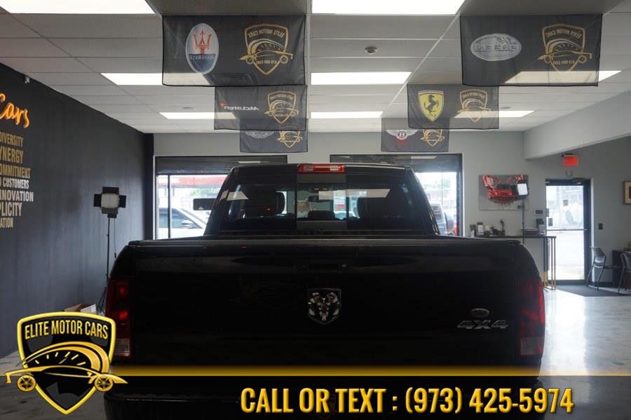 2012 Ram 1500 4WD Crew Cab 140.5" Sport, available for sale in Newark, New Jersey | Elite Motor Cars. Newark, New Jersey 2012 Ram 1500 4WD Crew Cab 140.5" Sport, available for sale in Newark, New Jersey | Elite Motor Cars. Newark, New Jersey