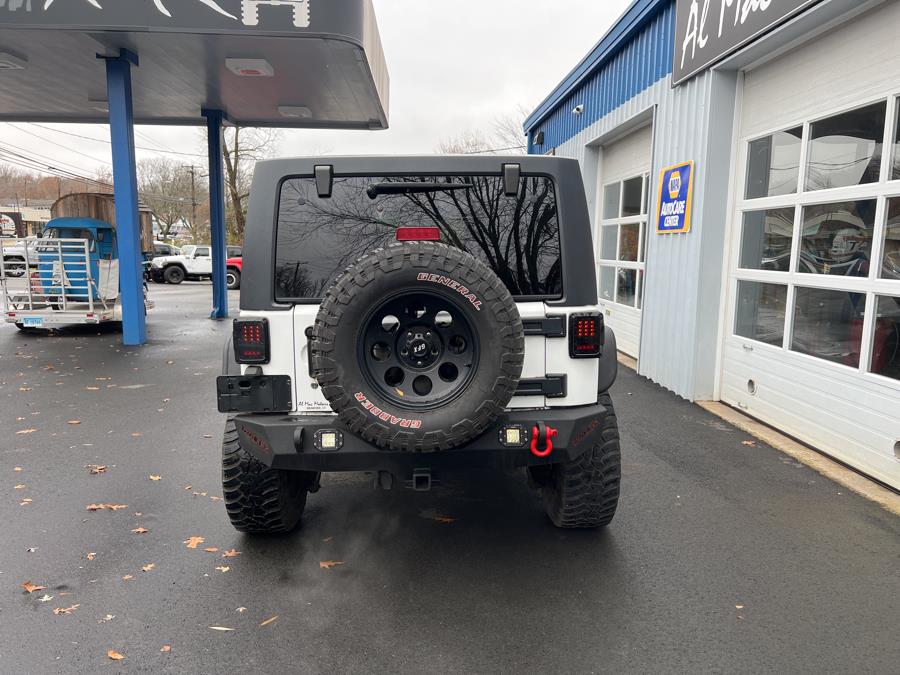 2013 Jeep Wrangler Unlimited 4WD 4dr Sport, available for sale in Branford, Connecticut | Al Mac Motors 2. Branford, Connecticut 2013 Jeep Wrangler Unlimited 4WD 4dr Sport, available for sale in Branford, Connecticut | Al Mac Motors 2. Branford, Connecticut