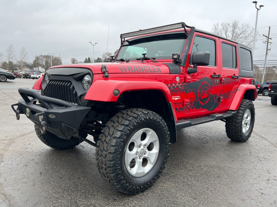 2014 Jeep Wrangler Unlimited 4WD 4dr Sahara, available for sale in Ortonville, Michigan | Marsh Auto Sales LLC. Ortonville, Michigan