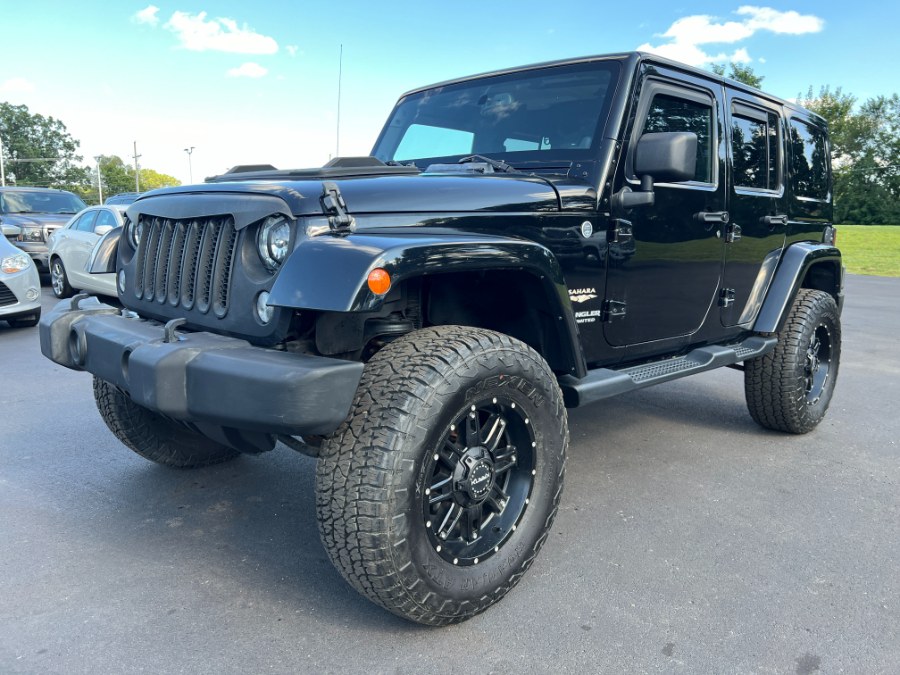 2014 Jeep Wrangler Unlimited 4WD 4dr Sahara, available for sale in Ortonville, Michigan | Marsh Auto Sales LLC. Ortonville, Michigan