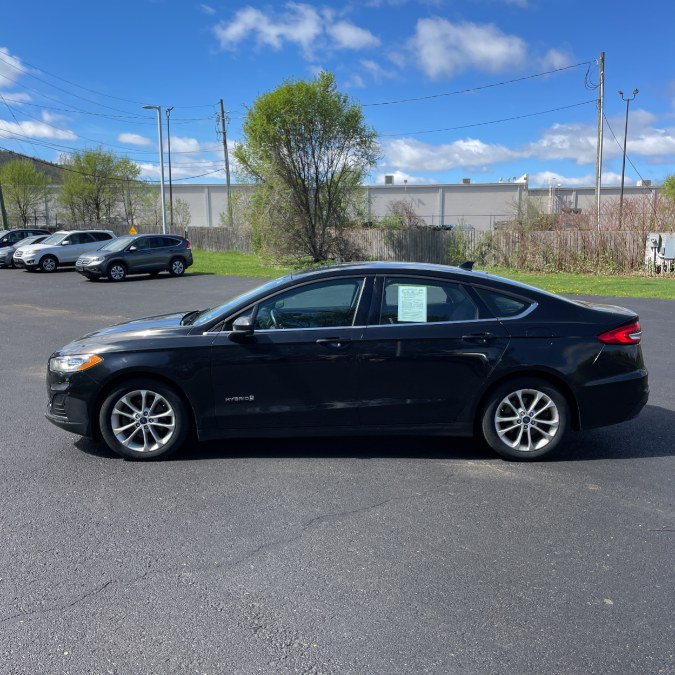 2019 Ford Fusion Hybrid SE FWD, available for sale in Hicksville, New York | REGAL AUTOHAUS. Hicksville, New York 2019 Ford Fusion Hybrid SE FWD, available for sale in Hicksville, New York | REGAL AUTOHAUS. Hicksville, New York