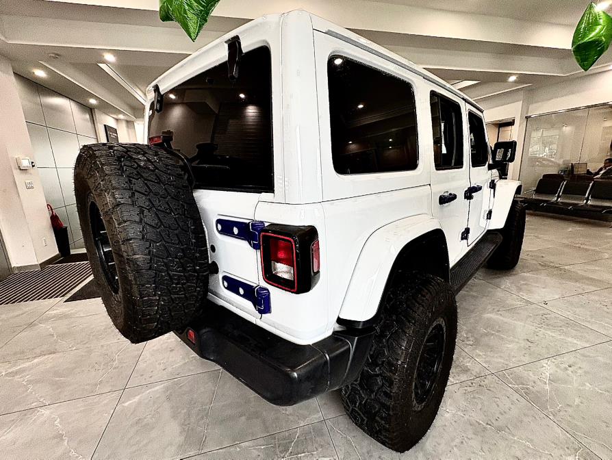 2022 Jeep Wrangler Unlimited Sahara Altitude 4x4, available for sale in Franklin Square, New York | Luxury Motor Club. Franklin Square, New York 2022 Jeep Wrangler Unlimited Sahara Altitude 4x4, available for sale in Franklin Square, New York | Luxury Motor Club. Franklin Square, New York