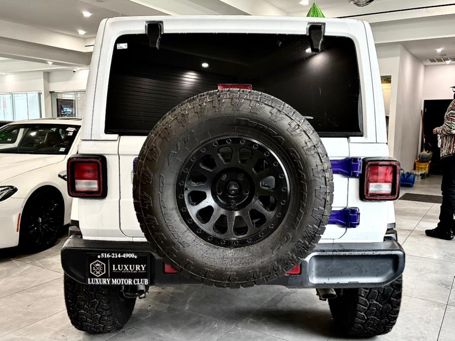 2022 Jeep Wrangler Unlimited Sahara Altitude 4x4, available for sale in Franklin Square, New York | Luxury Motor Club. Franklin Square, New York 2022 Jeep Wrangler Unlimited Sahara Altitude 4x4, available for sale in Franklin Square, New York | Luxury Motor Club. Franklin Square, New York
