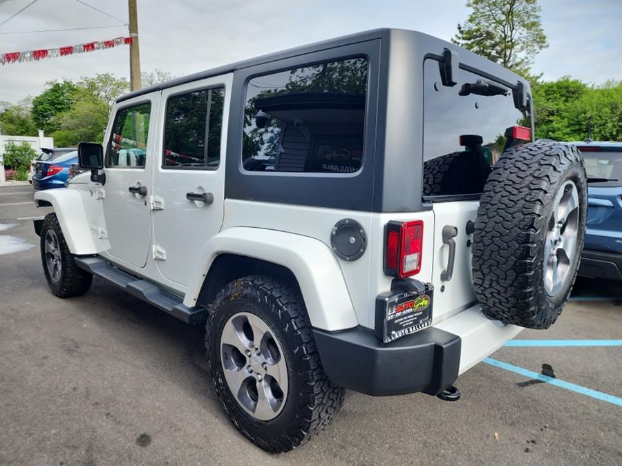 2016 Jeep Wrangler Unlimited 4WD 4dr Sahara, available for sale in Islip, New York | L.I. Auto Gallery. Islip, New York 2016 Jeep Wrangler Unlimited 4WD 4dr Sahara, available for sale in Islip, New York | L.I. Auto Gallery. Islip, New York