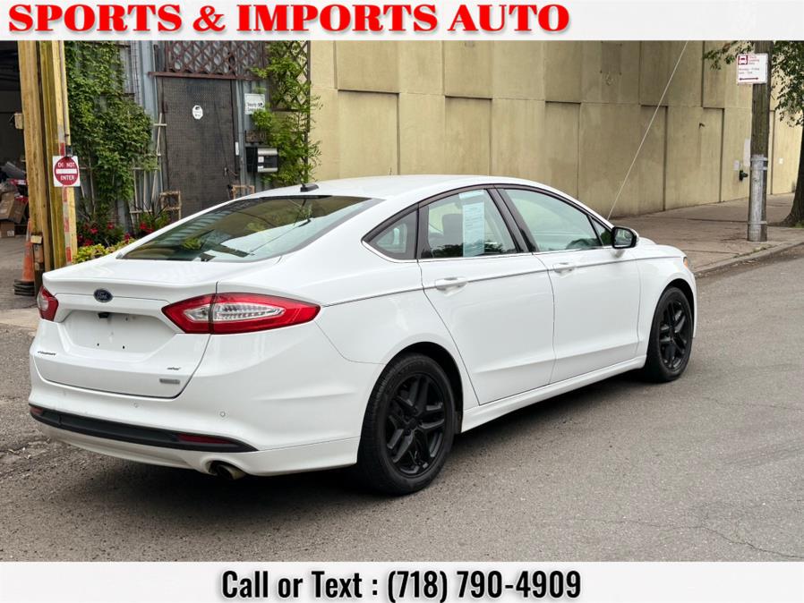 2014 Ford Fusion 4dr Sdn SE FWD, available for sale in Brooklyn, New York | Sports & Imports Auto Inc. Brooklyn, New York 2014 Ford Fusion 4dr Sdn SE FWD, available for sale in Brooklyn, New York | Sports & Imports Auto Inc. Brooklyn, New York