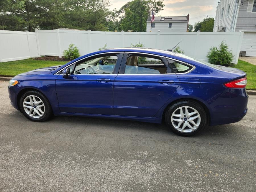 2014 Ford Fusion 4dr Sdn SE FWD, available for sale in West Babylon, New York | SGM Auto Sales. West Babylon, New York 2014 Ford Fusion 4dr Sdn SE FWD, available for sale in West Babylon, New York | SGM Auto Sales. West Babylon, New York