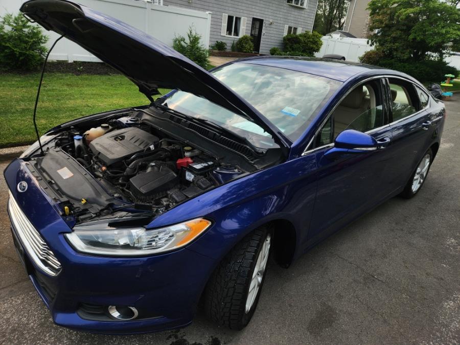 2014 Ford Fusion 4dr Sdn SE FWD, available for sale in West Babylon, New York | SGM Auto Sales. West Babylon, New York 2014 Ford Fusion 4dr Sdn SE FWD, available for sale in West Babylon, New York | SGM Auto Sales. West Babylon, New York