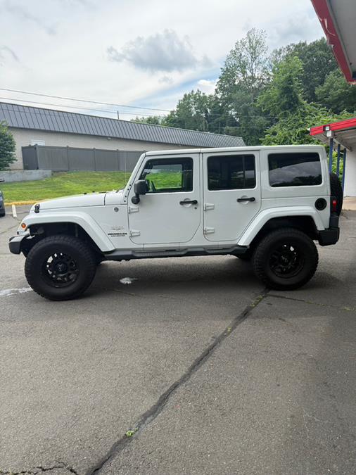 2012 Jeep Wrangler Unlimited 4WD 4dr Sahara, available for sale in Windsor Locks, Connecticut | JANNA MOTORS LLC. Windsor Locks, Connecticut 2012 Jeep Wrangler Unlimited 4WD 4dr Sahara, available for sale in Windsor Locks, Connecticut | JANNA MOTORS LLC. Windsor Locks, Connecticut