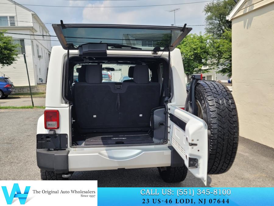 2011 Jeep Wrangler 4WD 2dr Sahara, available for sale in Lodi, New Jersey | AW Auto & Truck Wholesalers, Inc. Lodi, New Jersey 2011 Jeep Wrangler 4WD 2dr Sahara, available for sale in Lodi, New Jersey | AW Auto & Truck Wholesalers, Inc. Lodi, New Jersey