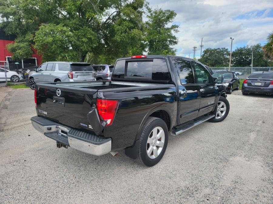 2013 Nissan Titan 2WD Crew Cab SWB SL, available for sale in Orlando, Florida | Mickeys Driver Mart. Orlando, Florida 2013 Nissan Titan 2WD Crew Cab SWB SL, available for sale in Orlando, Florida | Mickeys Driver Mart. Orlando, Florida