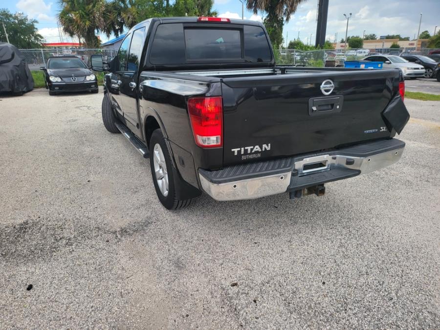 2013 Nissan Titan 2WD Crew Cab SWB SL, available for sale in Orlando, Florida | Mickeys Driver Mart. Orlando, Florida 2013 Nissan Titan 2WD Crew Cab SWB SL, available for sale in Orlando, Florida | Mickeys Driver Mart. Orlando, Florida