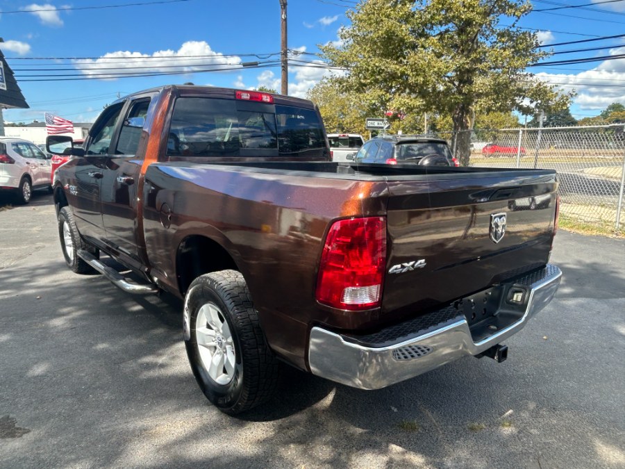 2014 Ram 1500 4WD Quad Cab 140.5" SLT, available for sale in West Babylon, New York | New Gen Auto Group. West Babylon, New York 2014 Ram 1500 4WD Quad Cab 140.5" SLT, available for sale in West Babylon, New York | New Gen Auto Group. West Babylon, New York