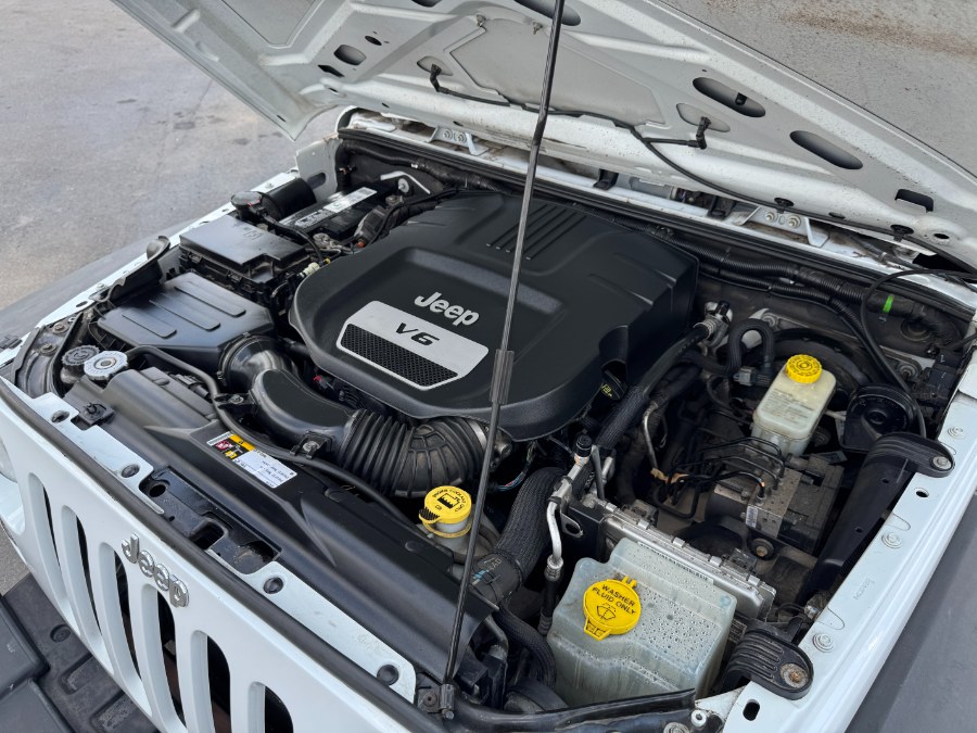 2014 Jeep Wrangler Unlimited 4WD 4dr Sport, available for sale in Ortonville, Michigan | Marsh Auto Sales LLC. Ortonville, Michigan 2014 Jeep Wrangler Unlimited 4WD 4dr Sport, available for sale in Ortonville, Michigan | Marsh Auto Sales LLC. Ortonville, Michigan
